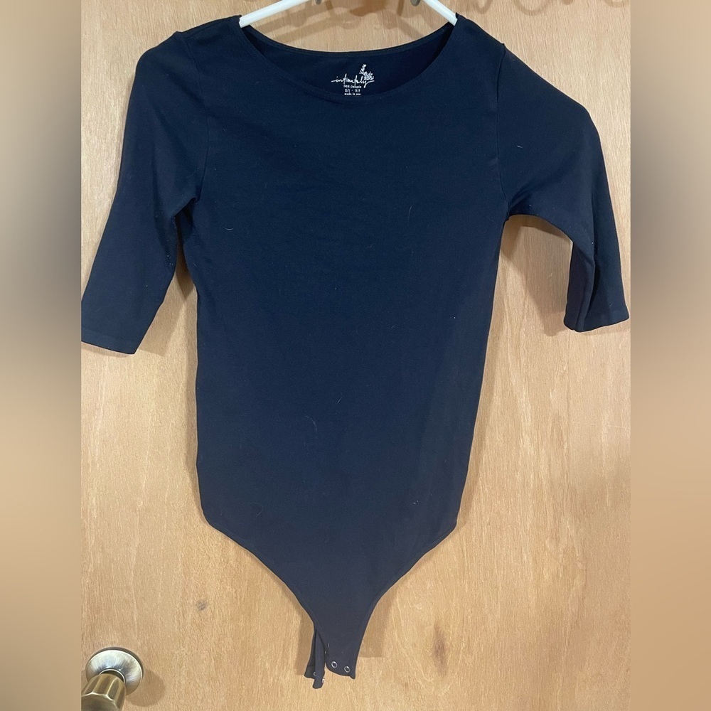 #190- INTIMATLY FREE-black body suit, size xs/s crew neck short sleeved